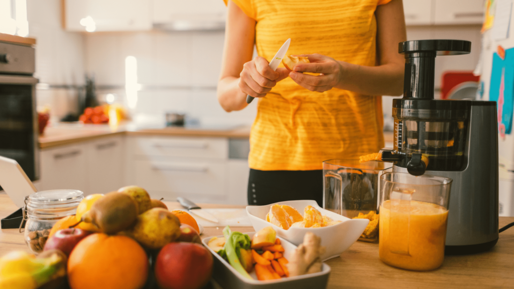 Best Cold Press Juicer, a women extracting juice from fruits with cold press juicer