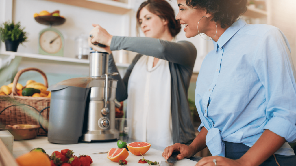 Best Commercial Juicer machine and 2 women extracting juice from commercial juicer